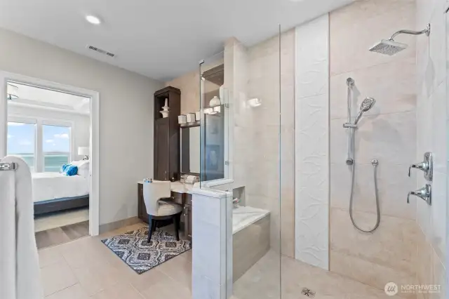 The shower with 2 shower heads, had a convenient seat and cubbies for essentials.
