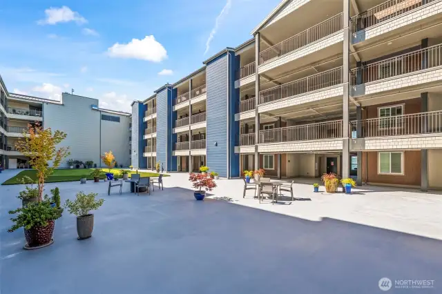 The courtyard is on the 5th floor. There is sun mid-day. Putt putt and Boce Ball
