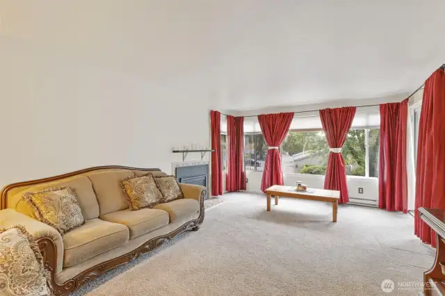 Spacious living room with lots of windows on main