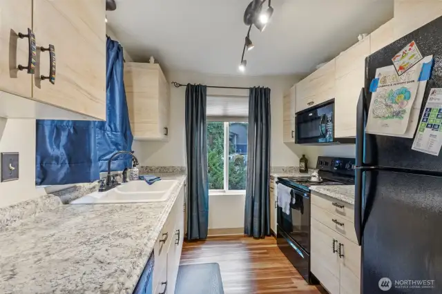 Galley kitchen with lots of natural light on main