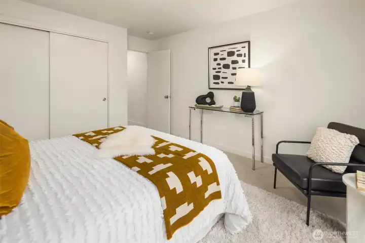 Top floor primary suite with walk-in closet.