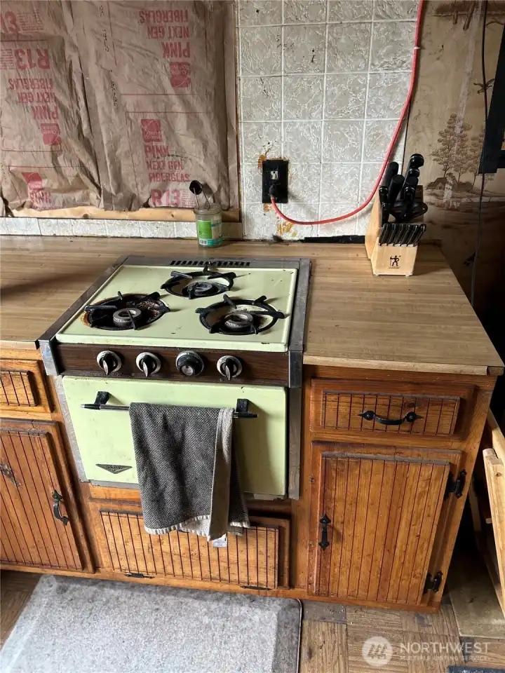 Propane range/oven in main cabin.