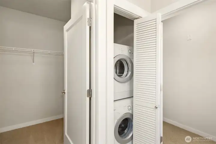 Washer dryer in primary bath.