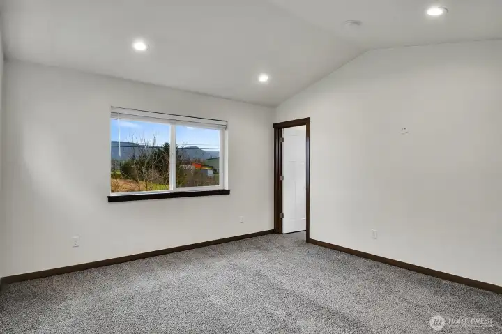 Primary Bedroom with Mini-Split, Vaulted Ceilings view toward the Bath