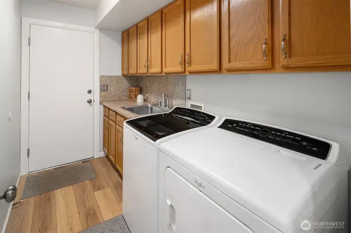 Laundry/utility room on main level leading to 3-car garage
