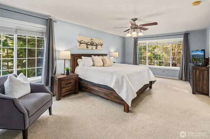 Primary bedroom offers beautiful view and sitting area