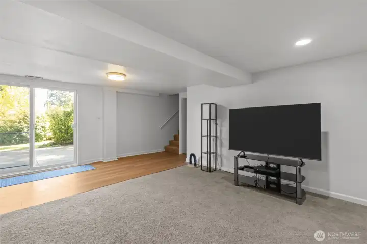 New flooring. There is storage to the right of the staircase, and the sliding door takes you out to you fabulous patio and backyard. Laundry, bath and bedroom are to the left down the hall.