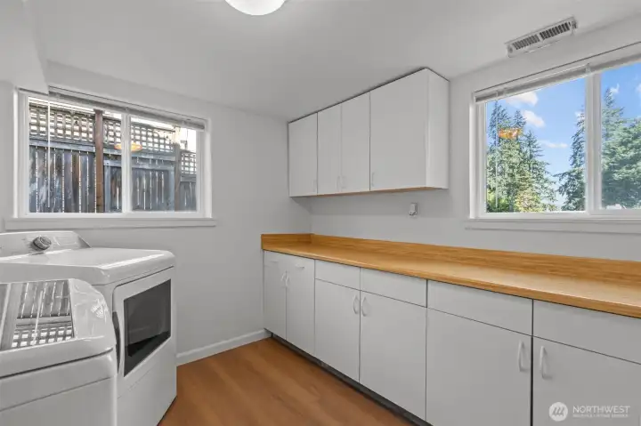 Look at all the space in this massive laundry room. Years ago when they updated the upstairs, the family lived downstairs and had used this as a small kitchenette!