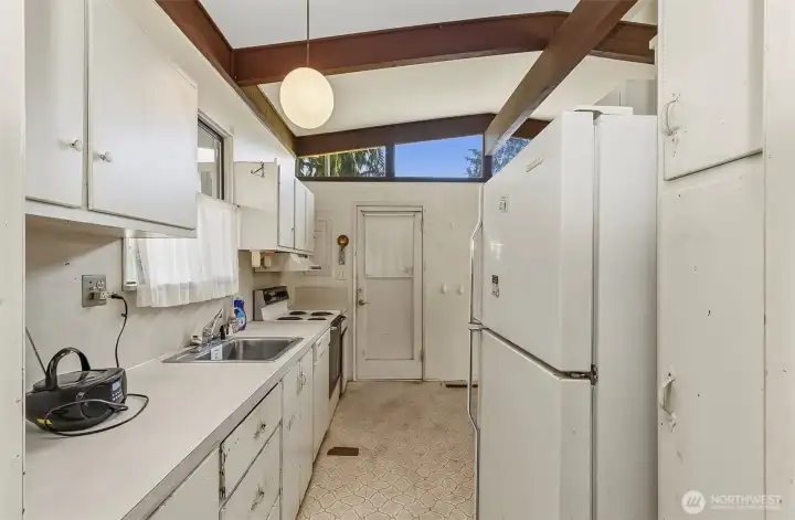 Galley Style Kitchen looking to the Side Door