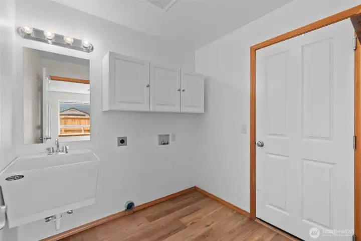 Laundry and mud room with big laundry sink.