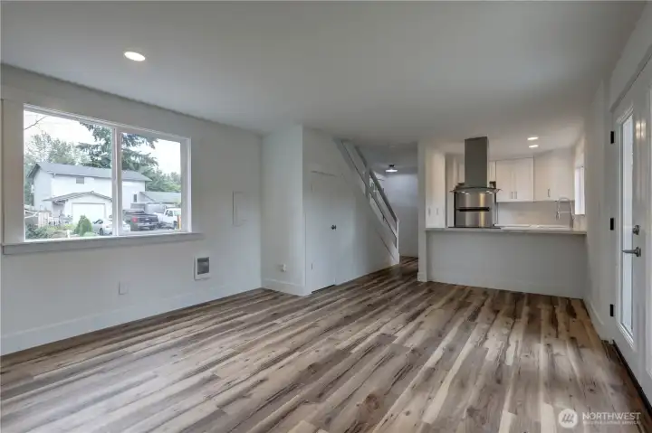 Light-filled interior featuring a seamless flow between living and kitchen spaces.
