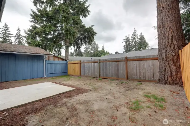 Private backyard with fresh topsoil and endless potential — ready for your personal touch and landscaping ideas.