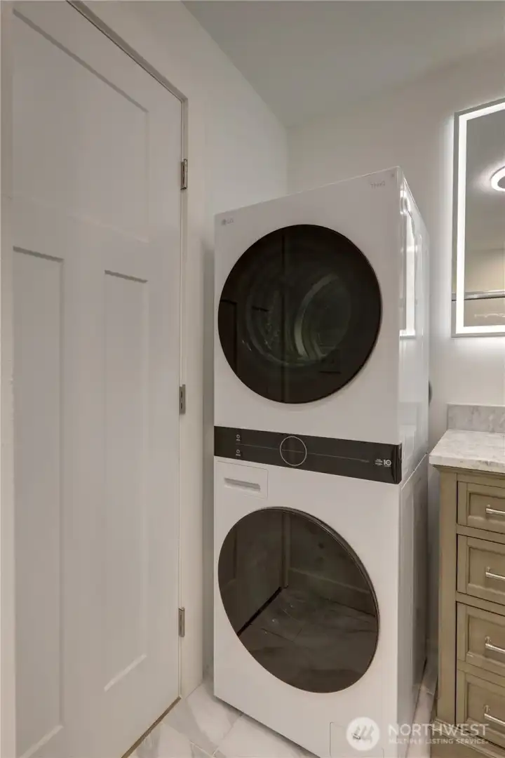 Full-size stackable washer and dryer for convenient space-saving living.