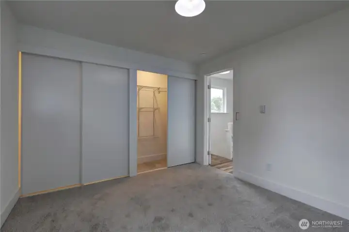 Nice-sized bedroom featuring spacious walk-in closets and plenty of room to relax and unwind.
