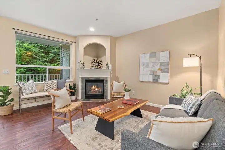END UNIT with tall ceilings and cozy gas fireplace!