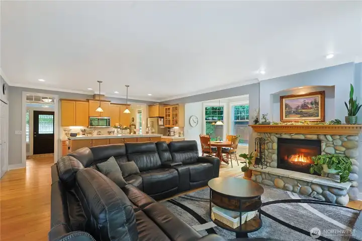 Massive living room with river rock fireplace.