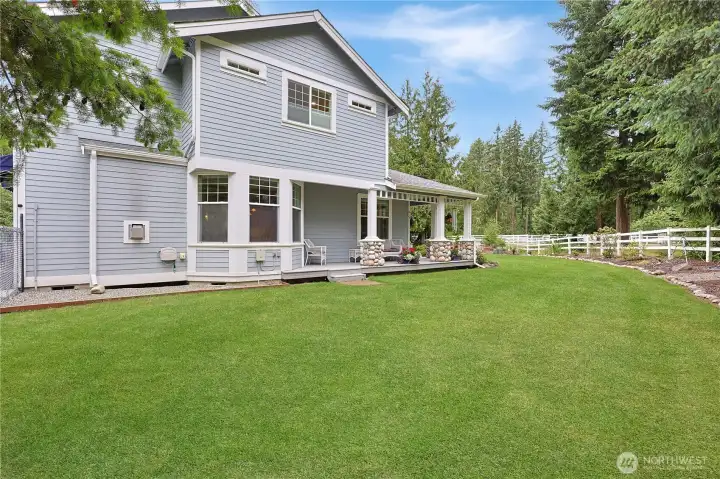 Look at the wrap around porch and manicured lawn!