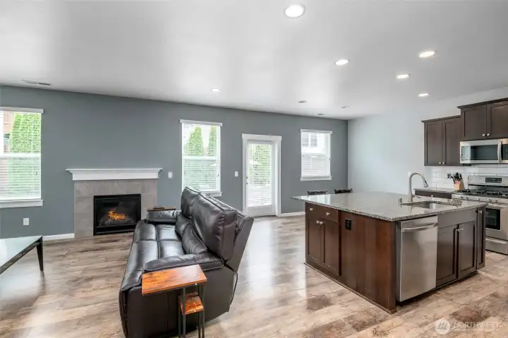 Kitchen and family room, natural lighting brightens the room Kitchen and family room, natural lighting brightens the room
