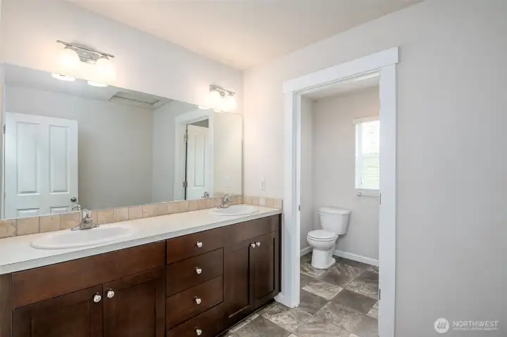 Secondary bathroom with door into tub/shower and toilet for privacy Secondary bathroom with door into tub/shower and toilet for privacy