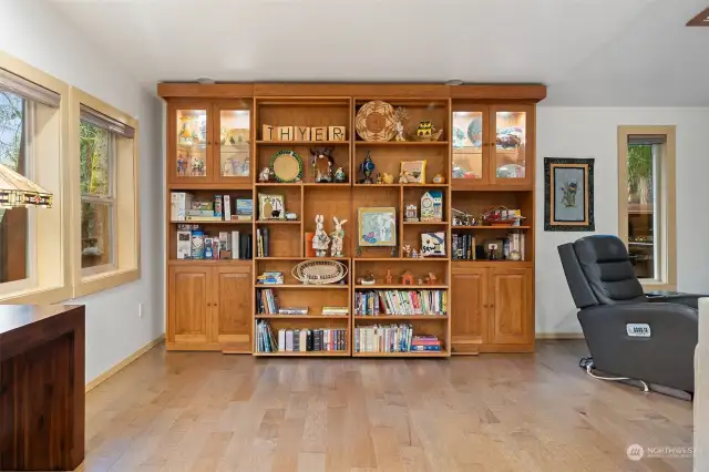 Bookcase in addition slides open to reveal Murphy bed