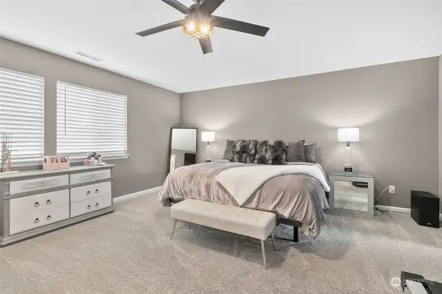Retreat to luxurious comfort in the expansive primary bedroom adorned with all-new plush carpeting, creating a serene sanctuary for relaxation and rejuvenation.