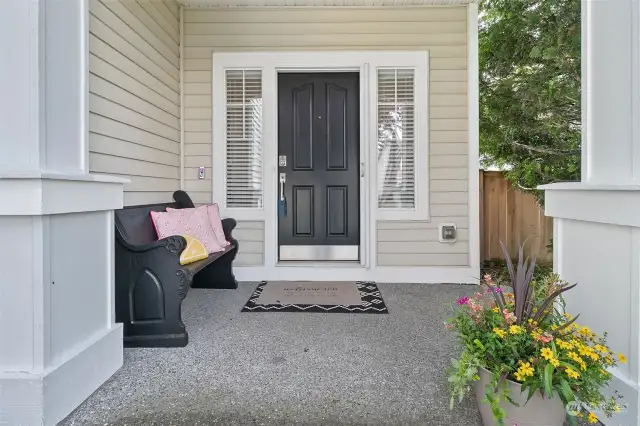 A charming front porch, easy to care for siding and classic columns greet you and your guests.