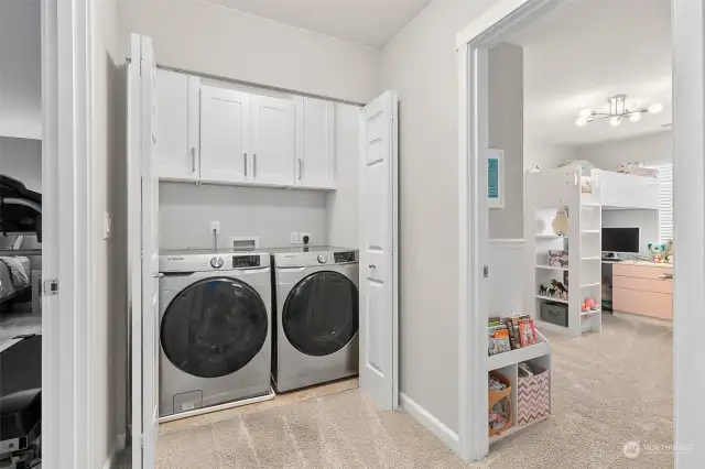 Upstairs and conveniently located next to the bedrooms is the laundry space with new cabinets and the washer and dryer are included.