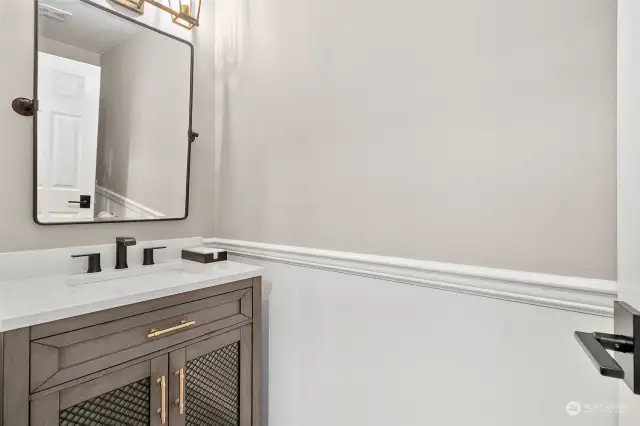 You and your guests will enjoy the newly renovated powder room, boasting a sleek quartz counter and modern lighting for an effortlessly chic experience.
