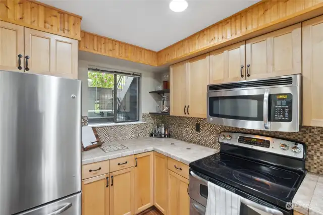 Kitchen features stainless steel appliances and a double oven.