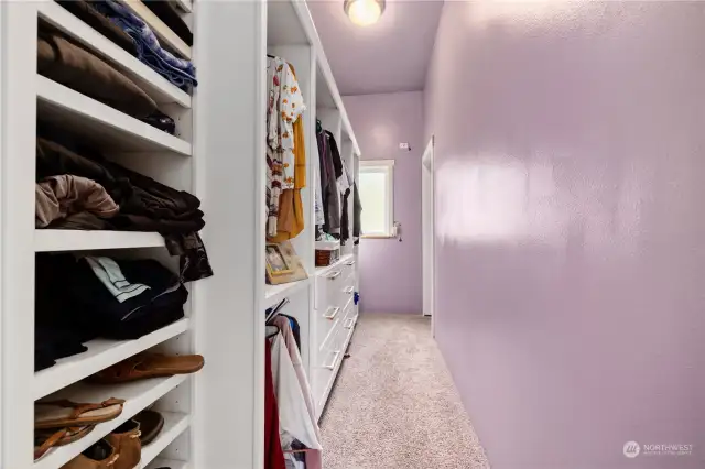 Primary walk-in closet with built-ins.
