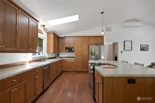The kitchen, remodeled in 2020, includes soft-close drawers and pull-out shelves in most cabinets.
