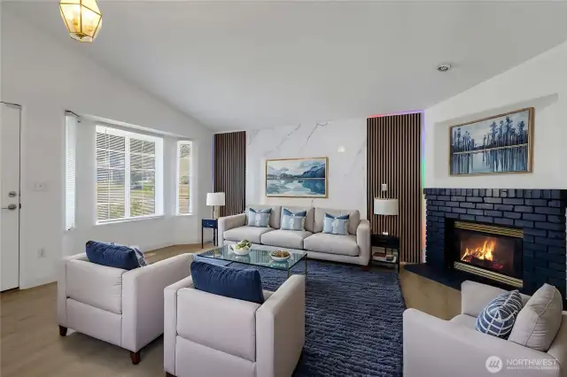 Virtually staged livingroom. Beautiful fireplace to sit and relax by