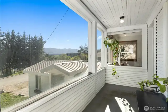 Enclosed front porch with a view.