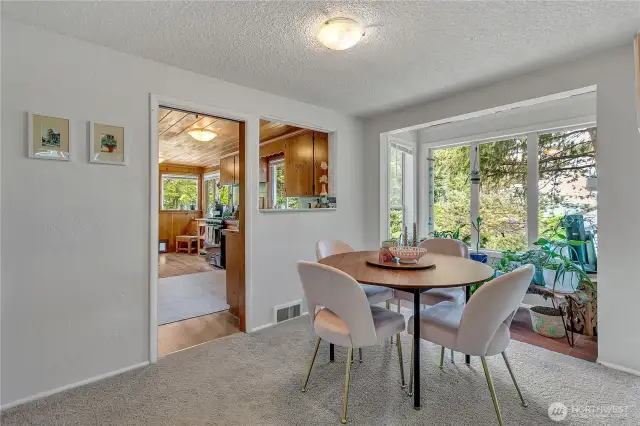Dining space has a great nook that gets lots of light. Great for plants!