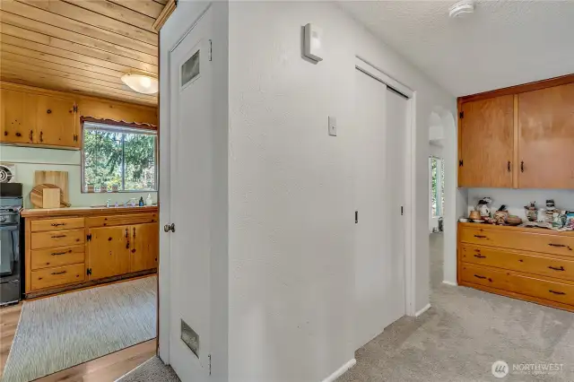 Hallway includes beautiful built-in cabinets and closet.
