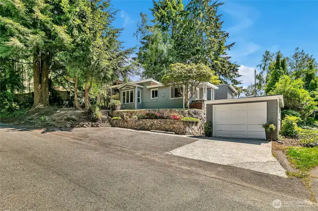 Plenty of parking in front of the home and detached garage.