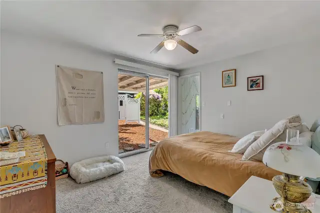 Primary room includes a 3/4 bath and slider that leads to the backyard.