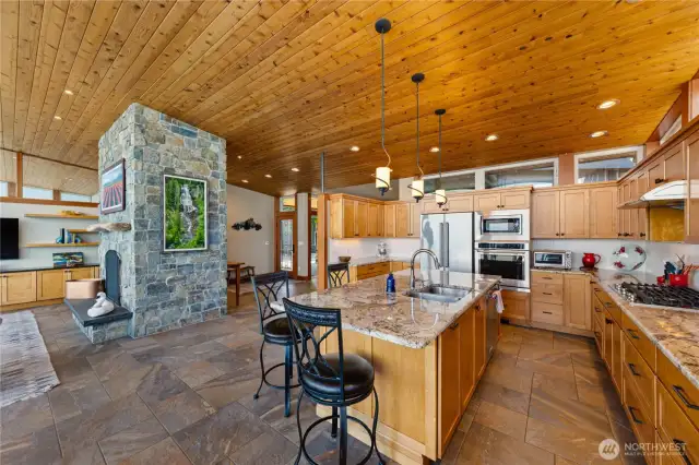 View from water side looking thru the kitchen and back towards the entry.