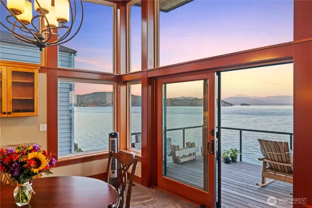 Sunset views from the dining room with sliders that open to the oversized water's edge deck.