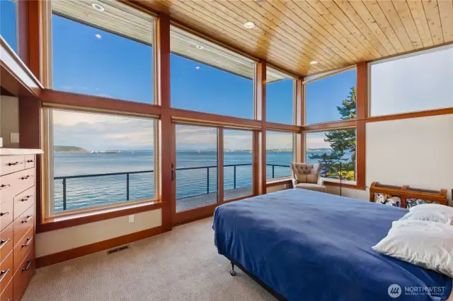 Wall of windows and glass sliders lead from the owner's suite onto the deck.