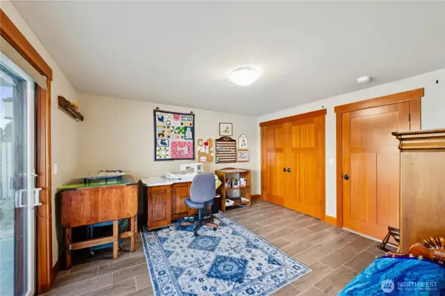 Second lower level bedroom is currently used as a hobby room with oversized closets for easy storage.