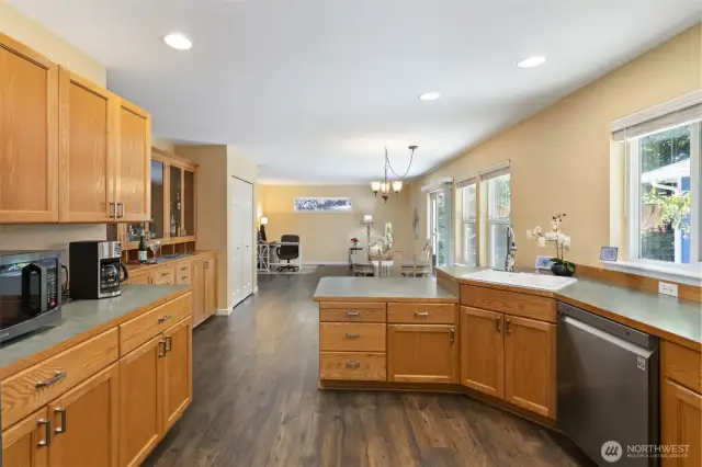 Main home kitchen looking into dining room.Main home laundry room/full bath off kitchen.