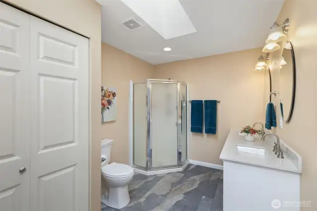 Main home primary bathroom with additional closet.