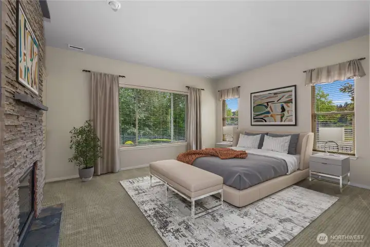 Primary bedroom and bathroom with gas fireplace, large closet and full tile shower.