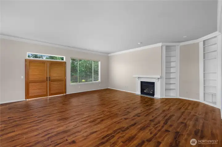 Large Great Room with engineered hardwood floors and gas fireplace.