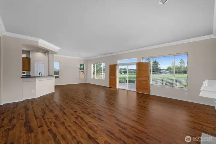 Large Great Room with engineered hardwood floors and gas fireplace.