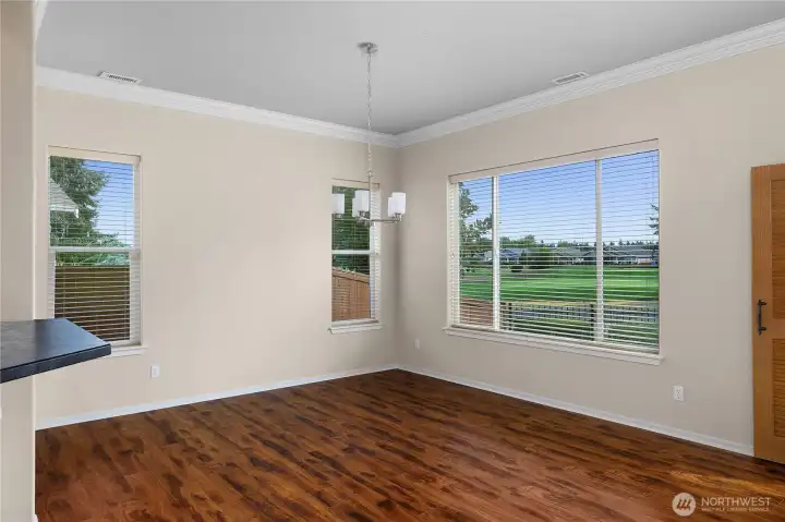Large Great Room with engineered hardwood floors and gas fireplace.