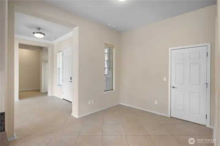 Flex sitting/dining space off kitchen that leads into laundry room.