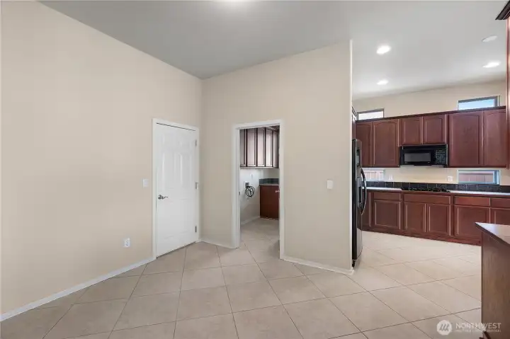 Flex sitting/dining space off kitchen that leads into laundry room.