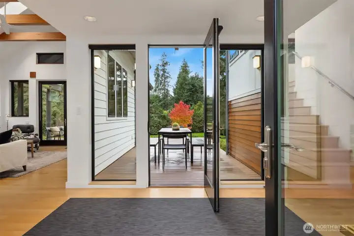 The entryway sets the tone with a nice flow to the garden deck. The living room, dining room and kitchen are to the left. The bedroom wing is to the right.